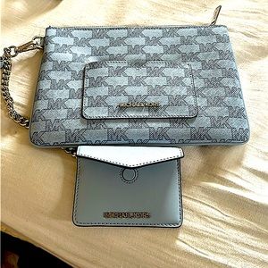 Brand new with tags Michael Kors purse/clutchlet